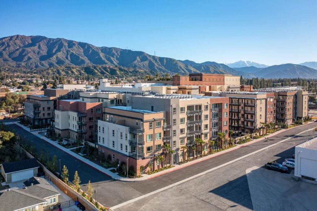 Exterior view of Esperanza at Duarte Station apartments for rent near Pasadena, CA with views of the San Gabriel mountains.